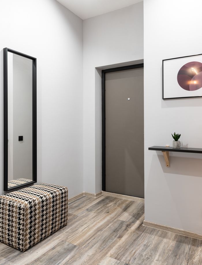 Interior of light hallway in minimalistic style placed in modern apartment in daytime